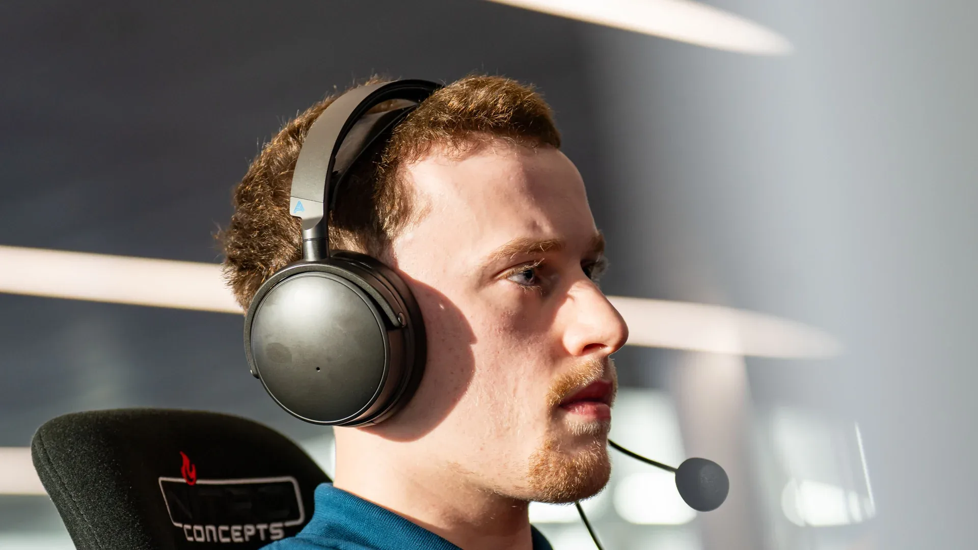 A RAFA ERA ESPORTS driver wearing headphones at a simulator during the ERL Final Four at Sim Formula Europe.