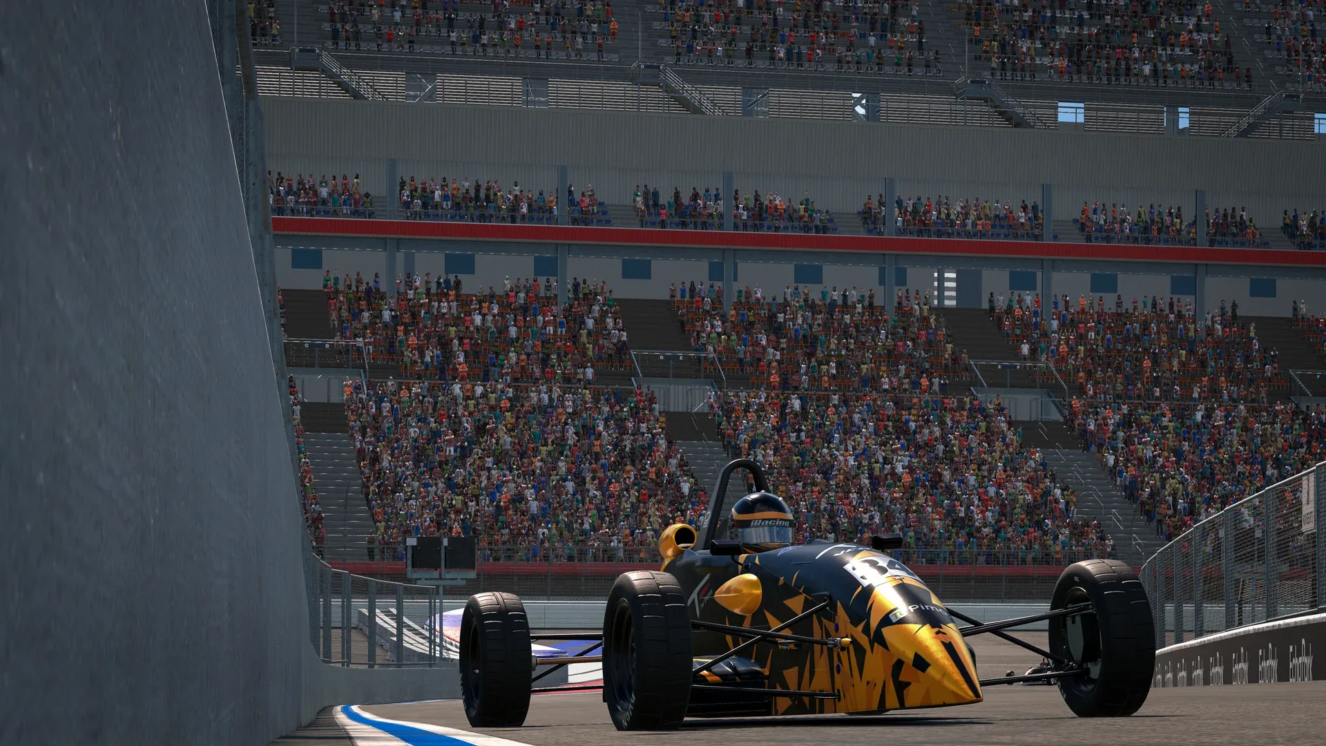 A yellow Formula Ford 1600 beside the grandstands at Charlotte during VCO INFINITY 2026 on iRacing.
