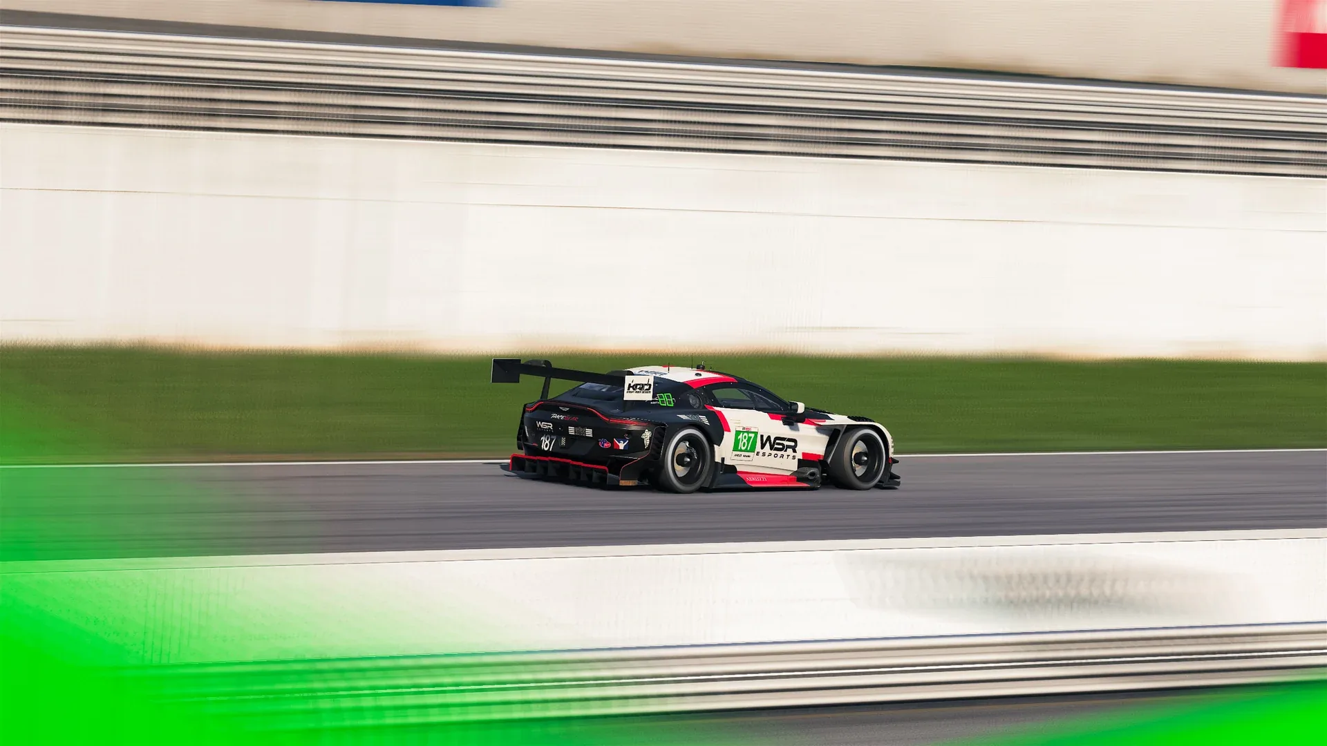 A WSR Esports Aston Martin Vantage GT3 in a side-on panning view at the 2026 IMSA Esports Road Atlanta round.
