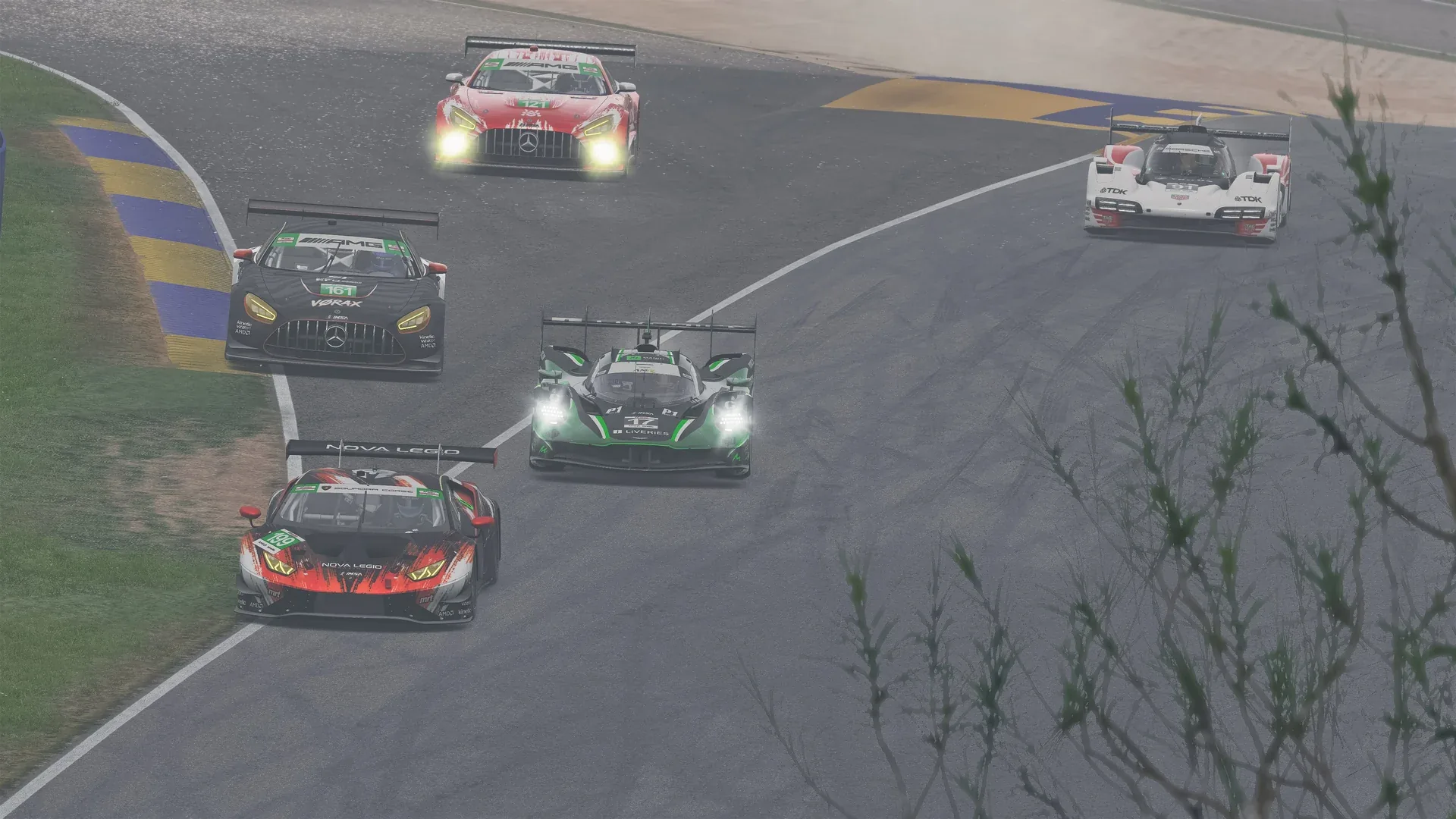 GT3 cars and an Aston Martin Valkyrie sharing a rain-soaked Road Atlanta circuit in IMSA Esports 2026.